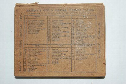 HARDY'S GOLD MEDAL TROUT FLY BOX. [Cardboard] [Circa 1883] With 10- #14 Woodcock & Green Eyeless Flies on gut snells; 5 -Uknown #16 Eyeless Flies on gut snells, plus Gut leader